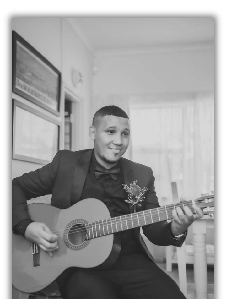 Jason Goliath playing guitar